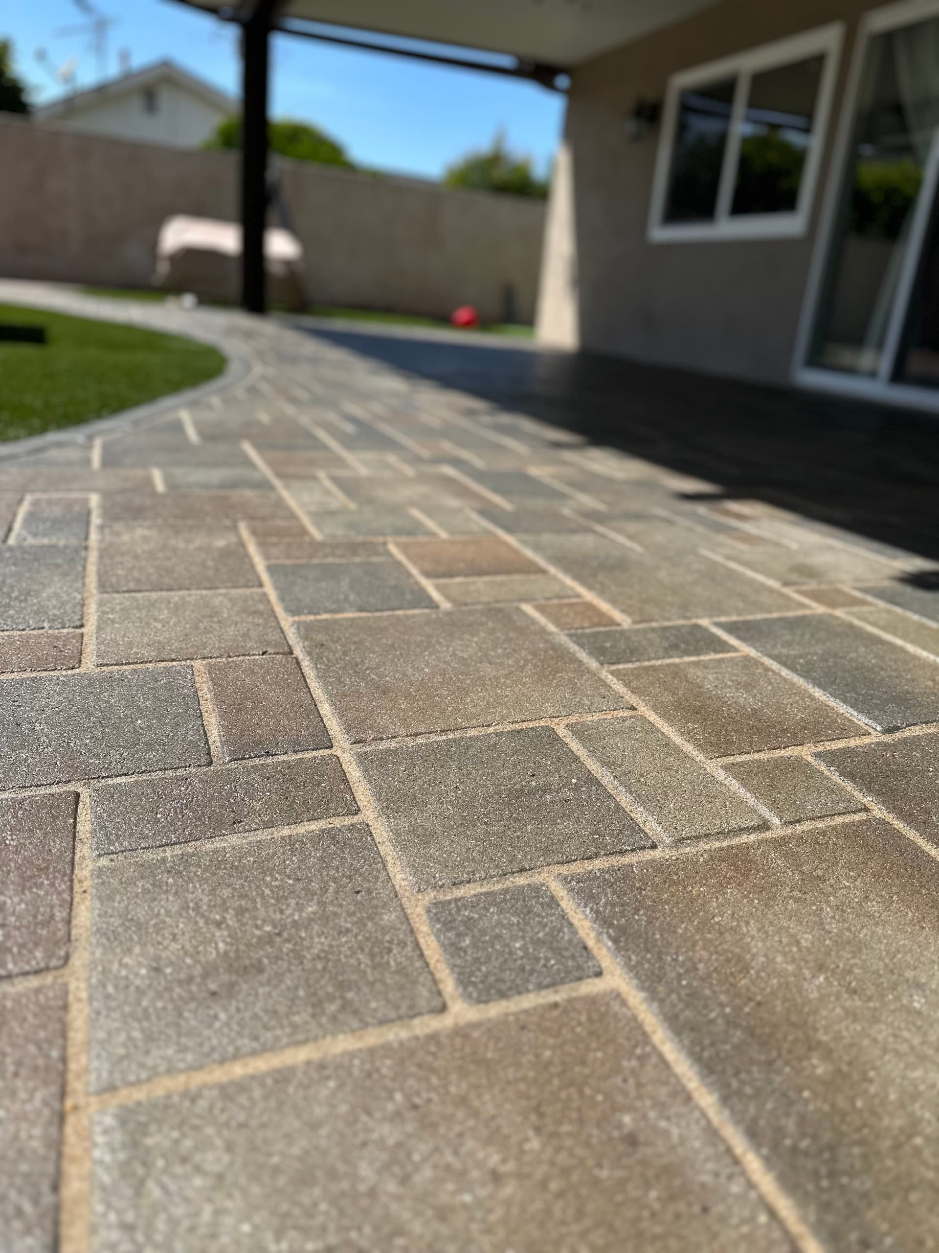 Re-sanded and resealed backyard pavers looking sharp image