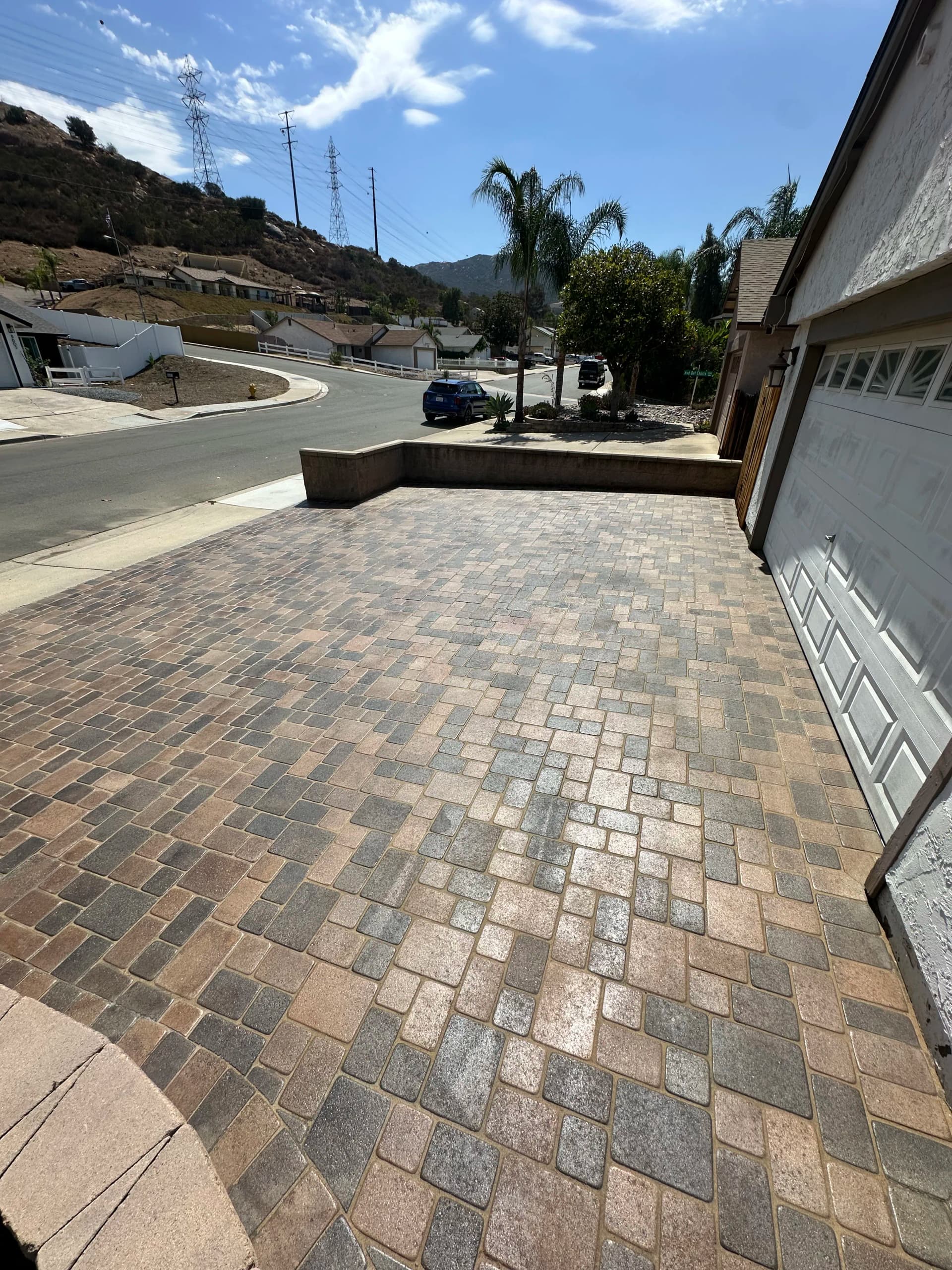 Paver Driveway Reset with Polymeric Sand and Fresh Seal image
